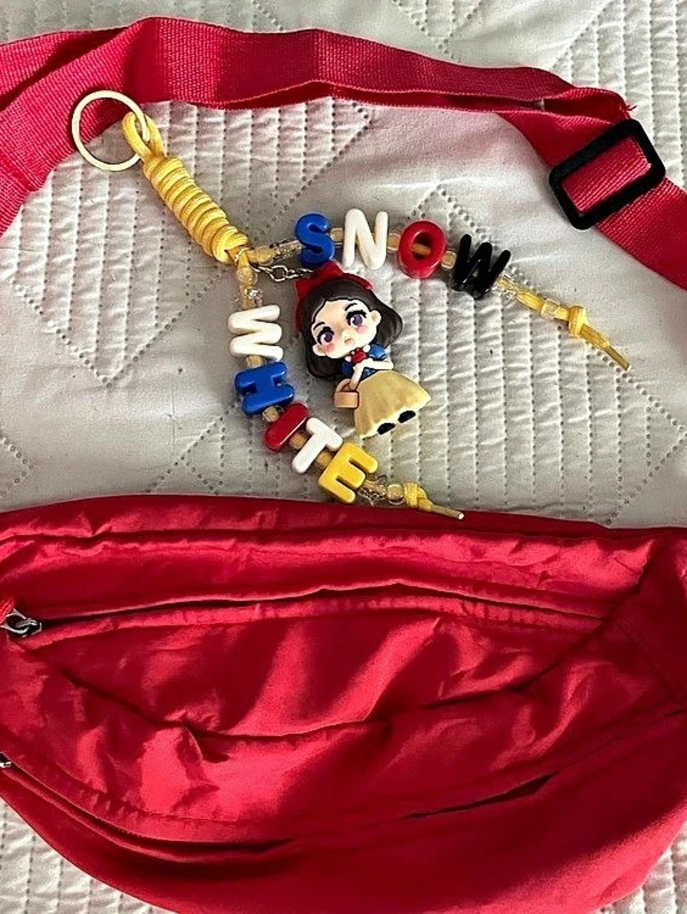 Red crossbody bag with Snow White bag charm